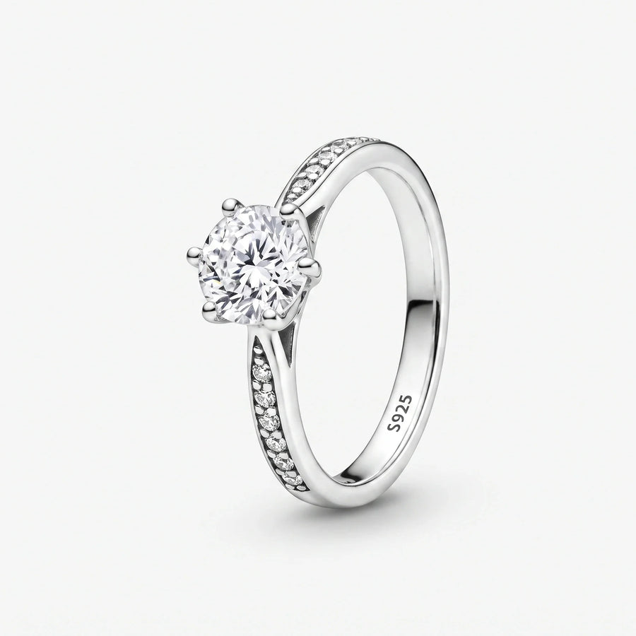Pierścionek soliter Wieczność 925 z okrągłym kamieniem centralnym i oprawą pavé na ramionach