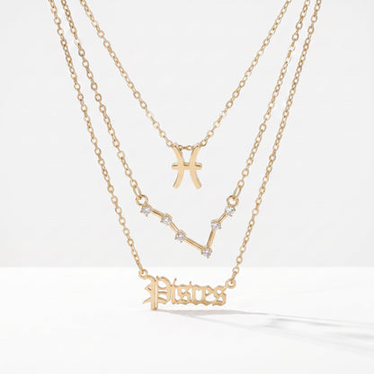 Zestaw 3 złotych naszyjników ze znakiem zodiaku Ryb.